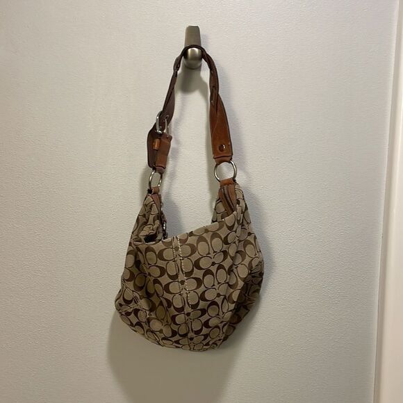 Coach woman’s brown canvas with twisted brown leather strap. - Picture 5 of 11